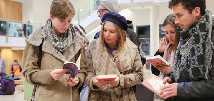 Students browse books being sold at a stall in the New Academic Building