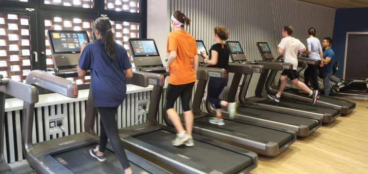 Students running on treadmills at the SU gym